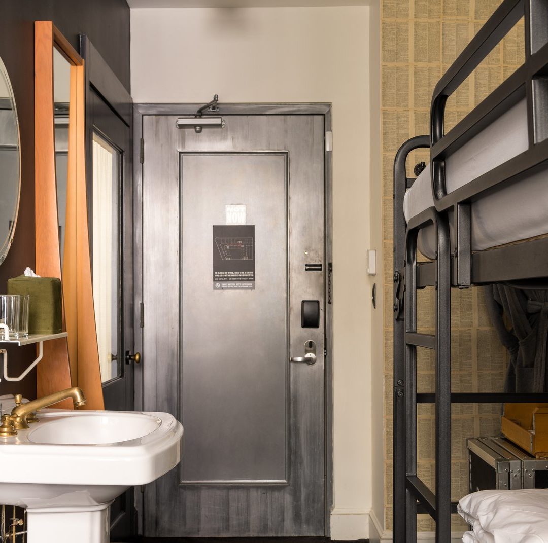 A cozy room features a sink and private toilet area